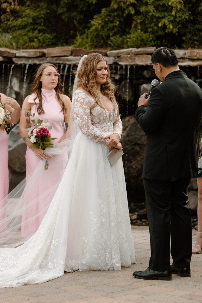 Couple exchanging vows by the fountain