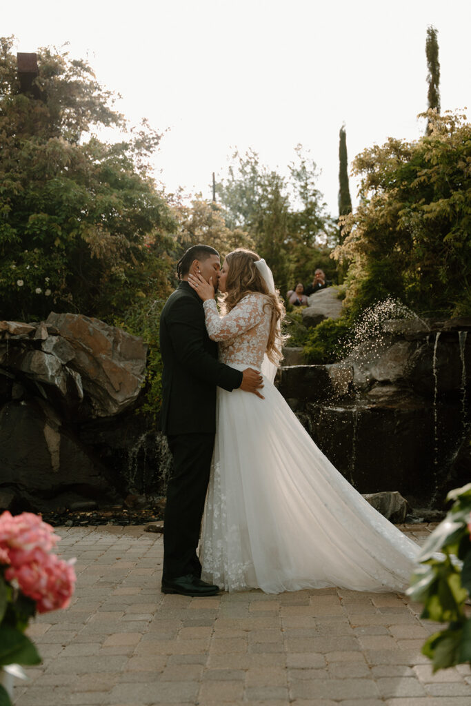 Backlit wedding portrait with sun flare through the ceremony spot
