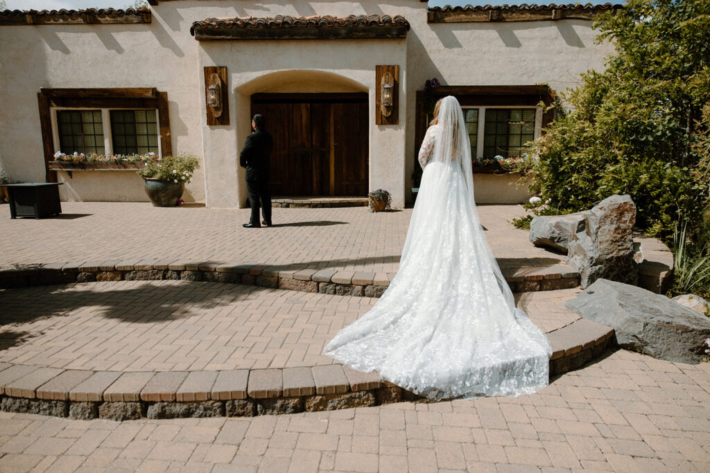 Bride viewing groom before the first look