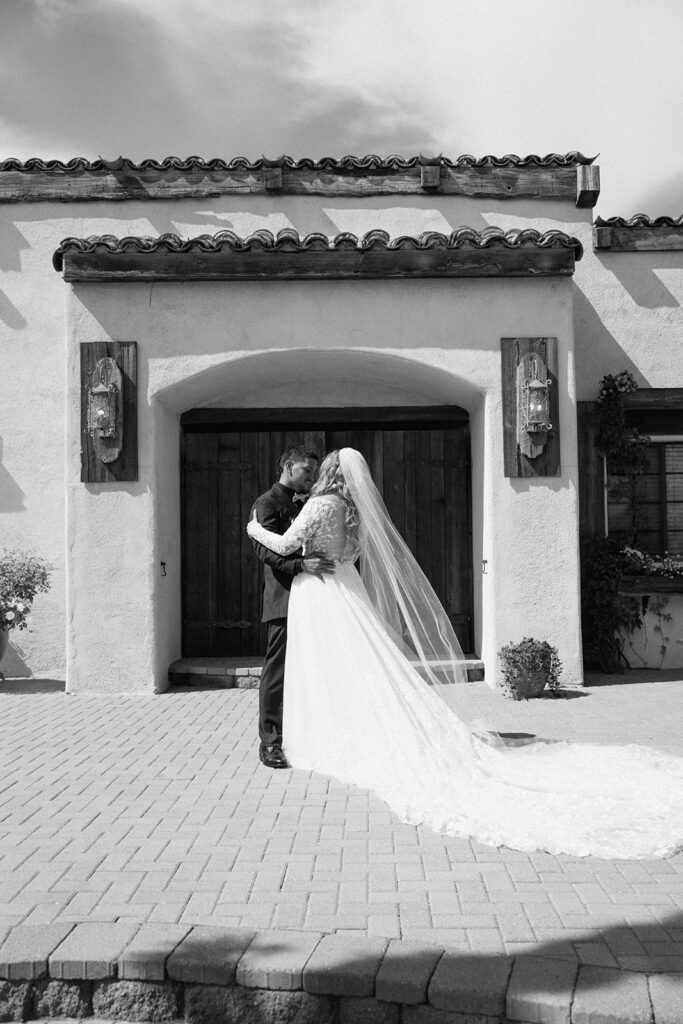 Couple embracing during emotional first look at Las Cascadas Italian-inspired venue near Reno Tahoe